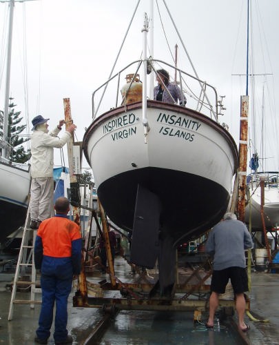 The Milford team preparing Inspired Insanity to go back into the water. © Jane Pares - IMB